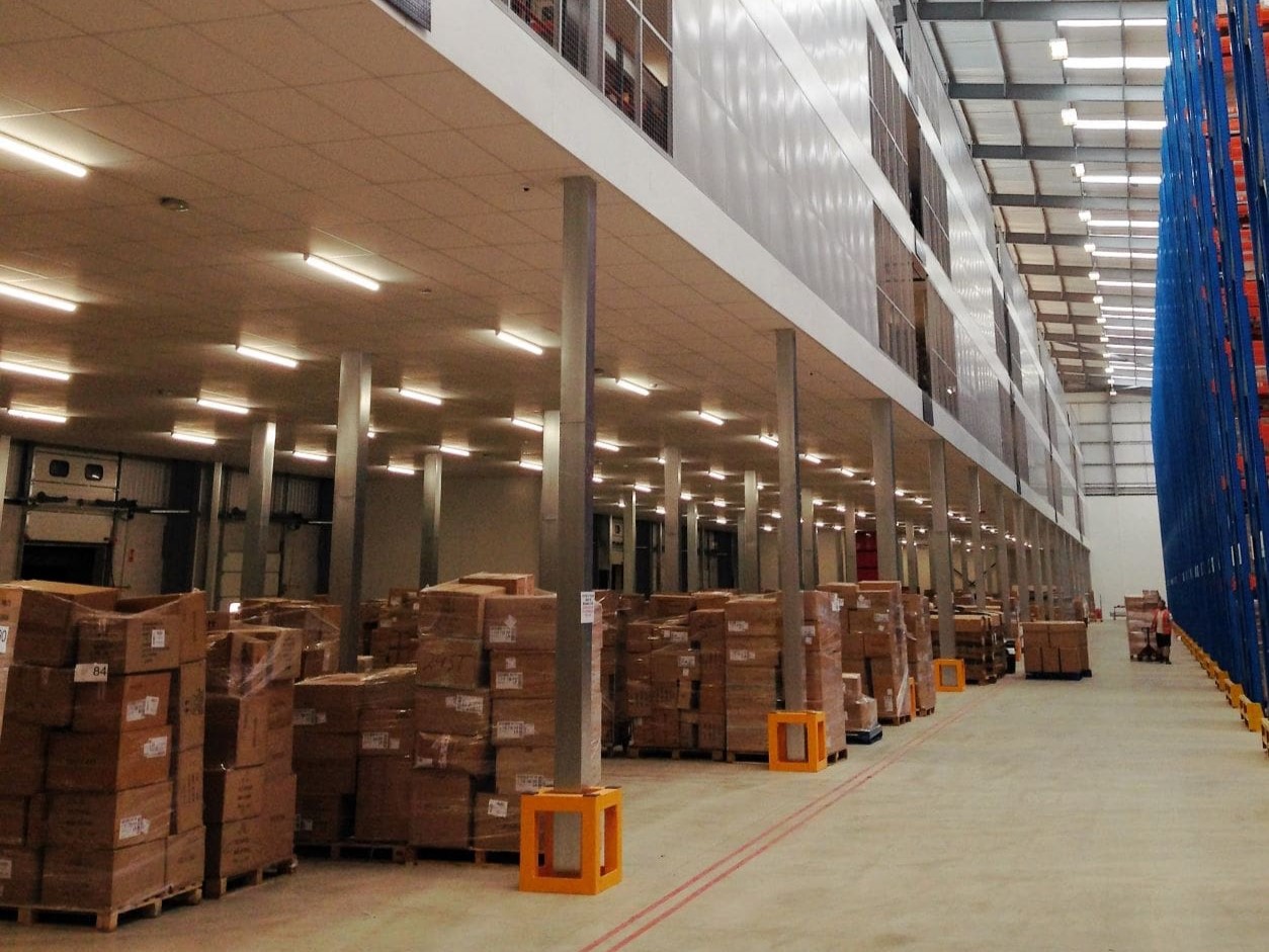 warehouse with mezzanine and pallets of goods