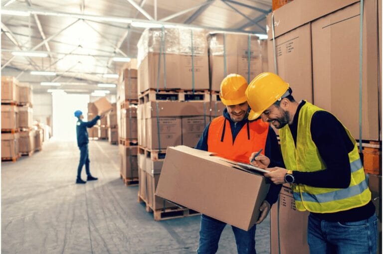 warehouse workers with palletised boxes